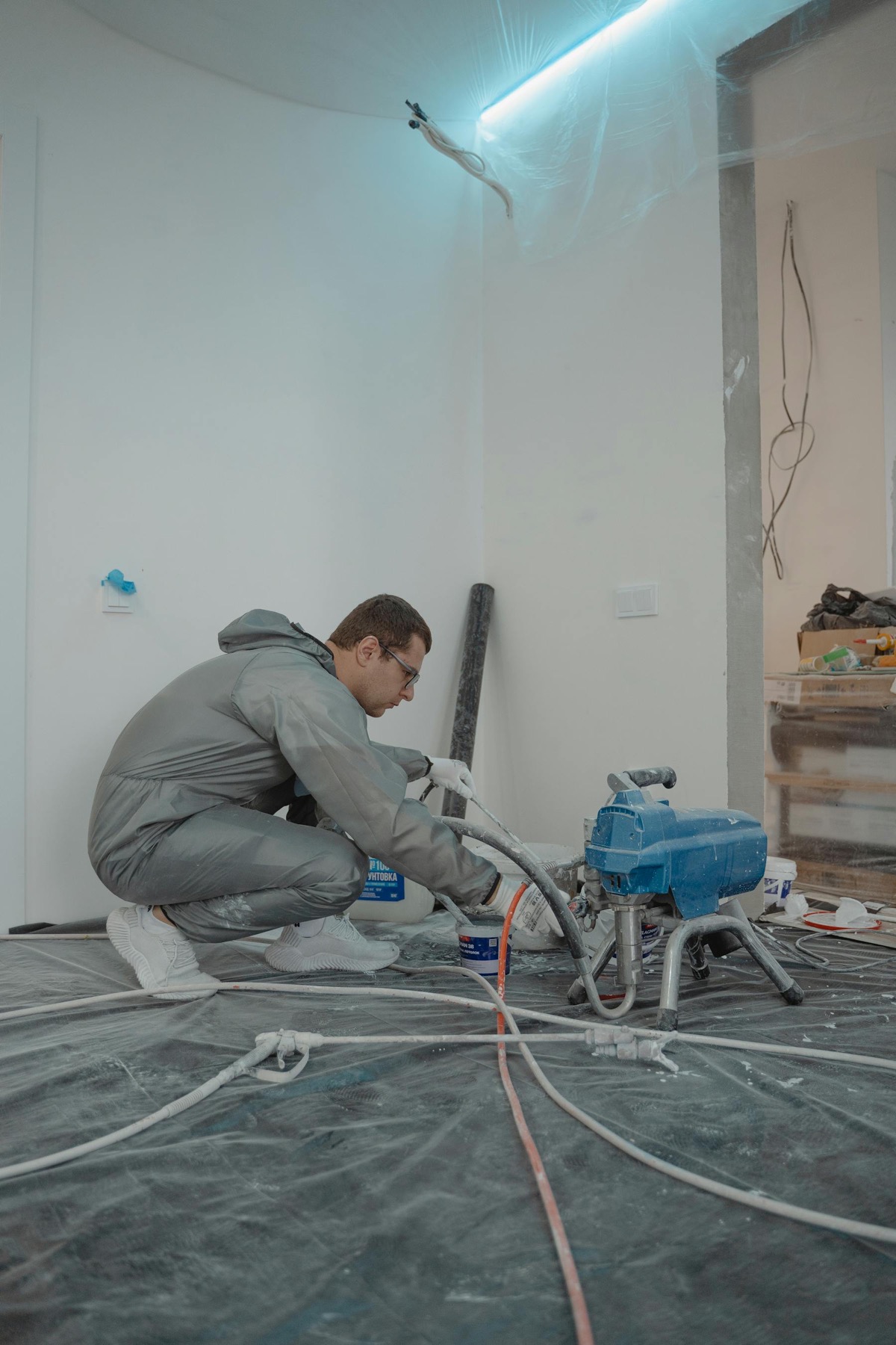 Restoration technician checking an interior wall during water damage work